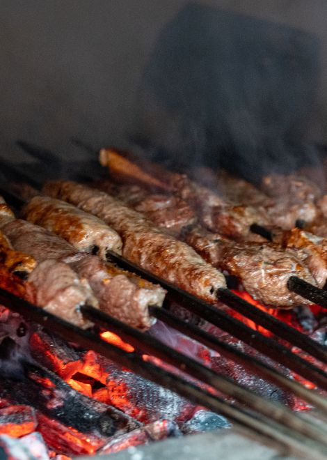 Smoky kebabs grilling over charcoal