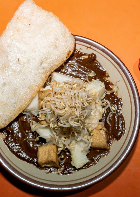 Tipat tahu, fried tofu in rich chilli-spiked peanut sauce