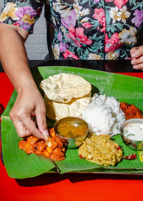 Banana leaf thali with crisp papads